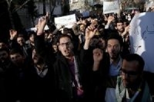 Iranian university students stage rally to protest killing of Muslim students in US