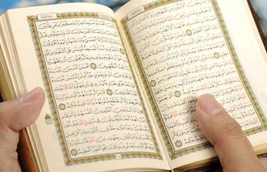 Is it permissible to recite the Quran with music?